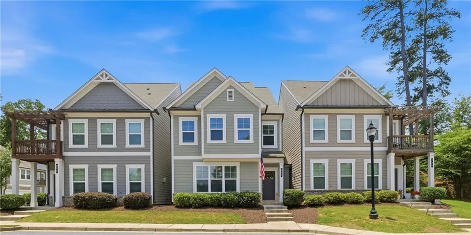 Contemporary multi-unit residence featuring multiple gables and a combination of horizontal siding and shingle accents