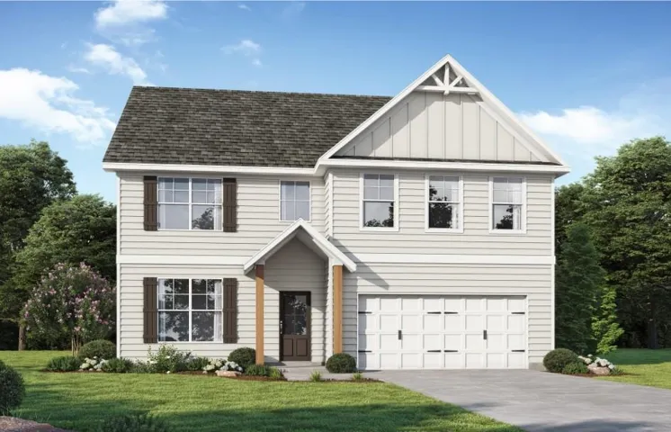 Two-story exterior with light-colored siding, dark shingle roof, and a two-car garage