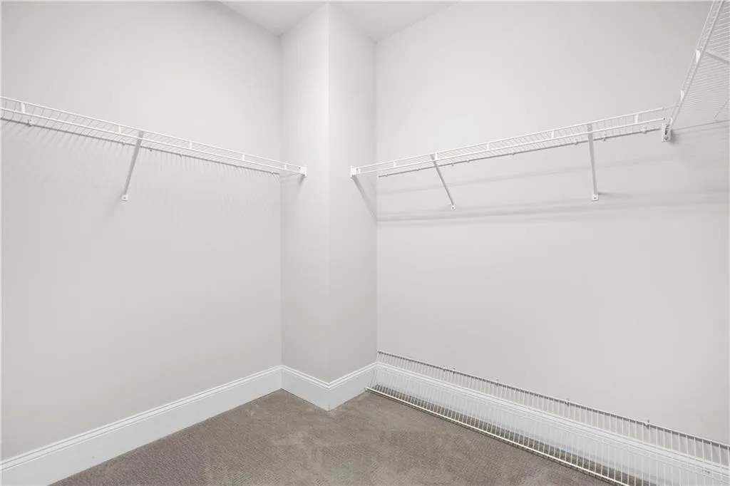 Spacious closet with carpet floors