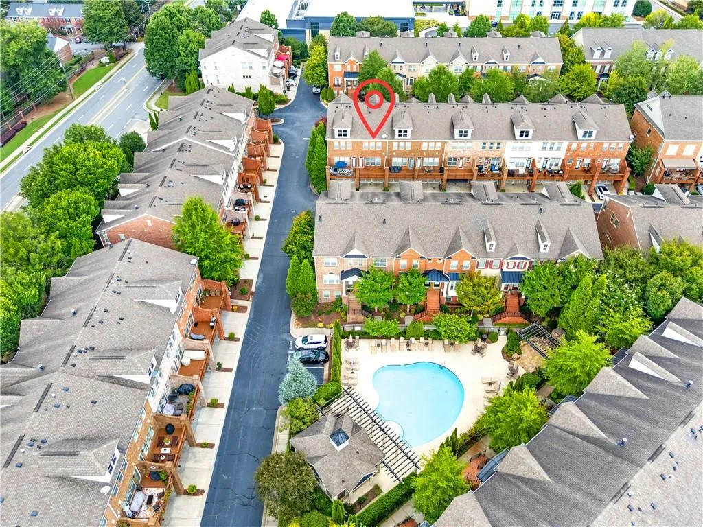 Aerial perspective of suburban area featuring a pool area