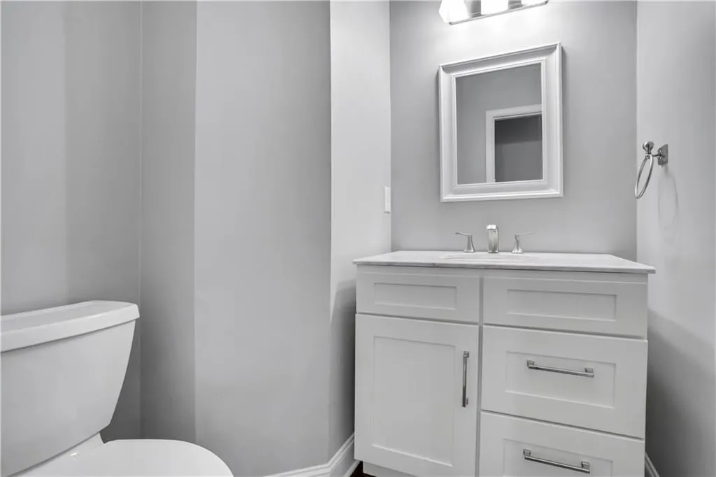 Bathroom featuring vanity and toilet Bathroom featuring vanity and toilet