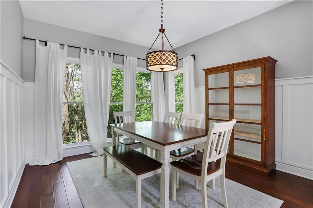 Dining room featuring dark wood-type flooring Dining room featuring dark wood-type flooring