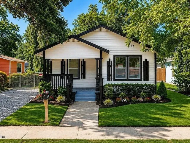 White siding exterior with dark trim accents
