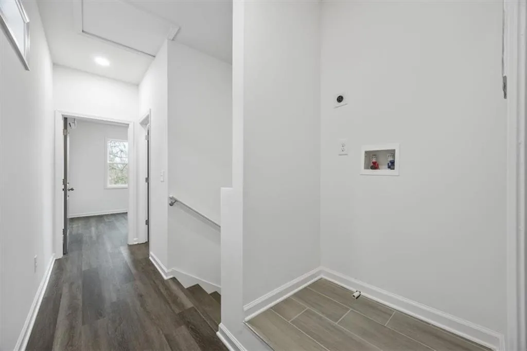 Laundry area with dark hardwood / wood-style floors, electric dryer hookup, and hookup for a washing machine
