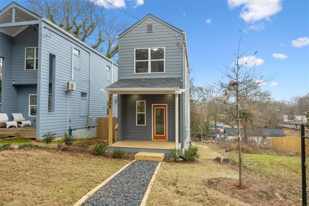View of front of house with a front yard