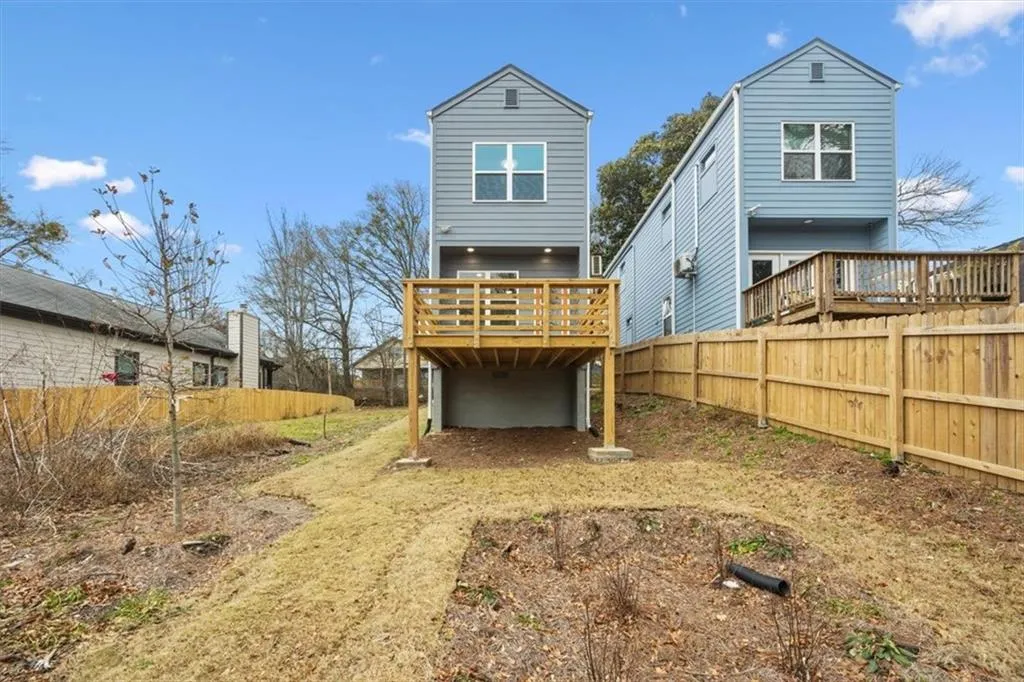 Rear view of house featuring a deck