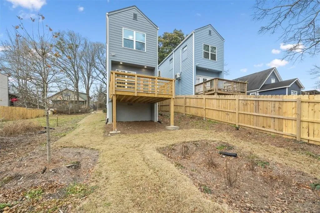 Back of property featuring a deck