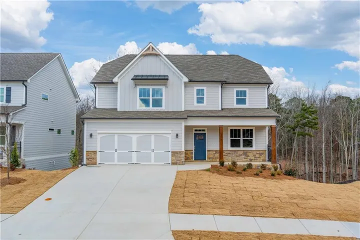 Craftsman inspired home featuring a garage