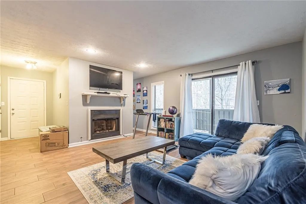 Living room with light wood-type flooring