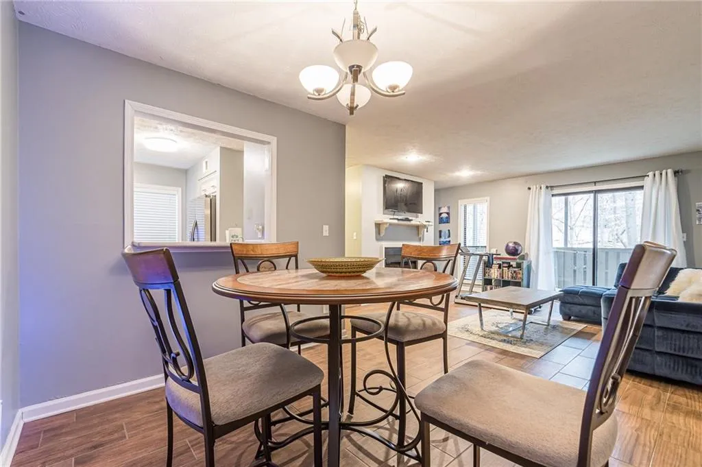 Dining space with a chandelier and hardwood / wood-style floors