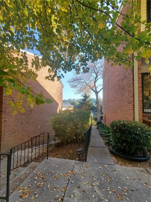 View of side of property with brick siding