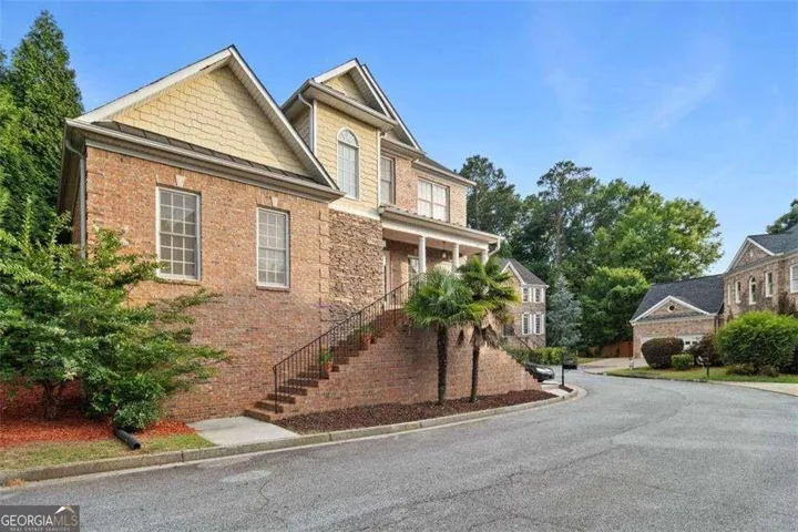 Brick exterior with stone accents and gabled rooflines