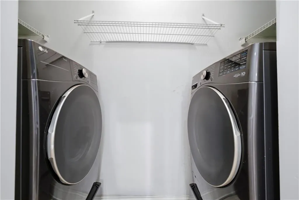 Laundry room featuring washing machine and clothes dryer