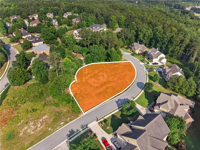 Aerial rendering of a land lot on a paved, curved street