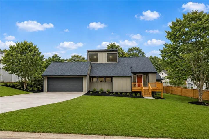 Contemporary exterior with a prominent second-story window feature