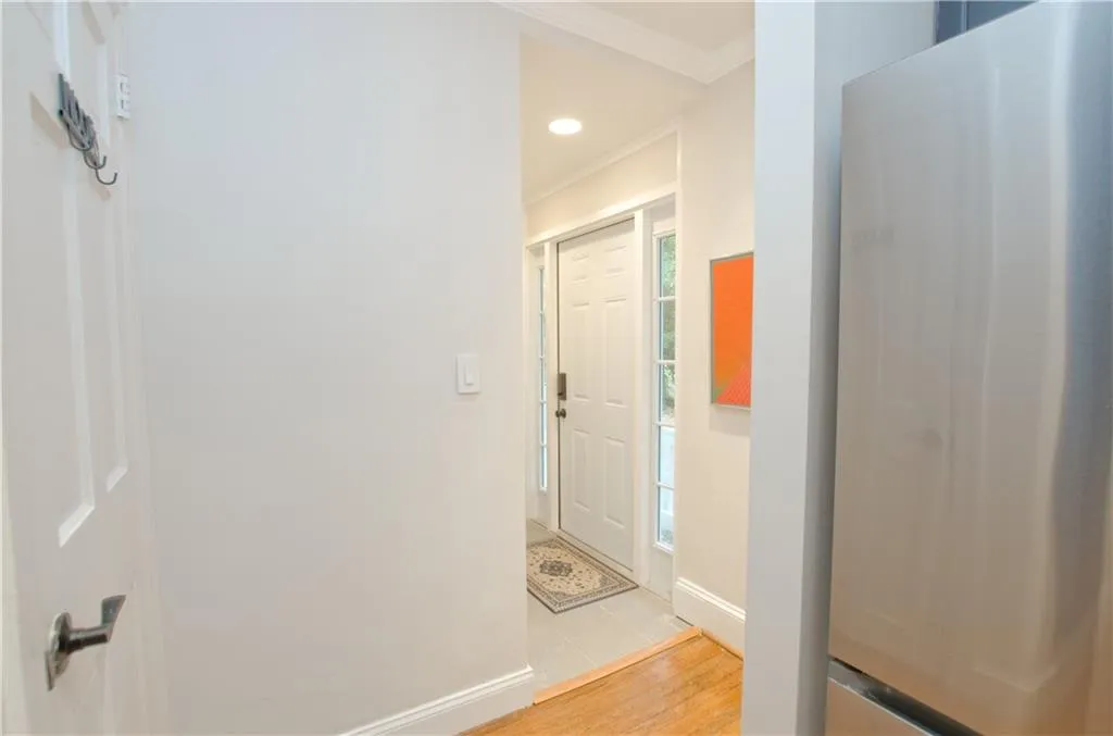 The back door has a separate entry area with a tile floor.