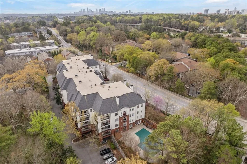 Aerial view of city skyline and a tree filled landscape