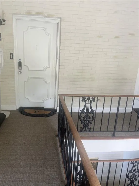 View of Unit entry featuring a balcony