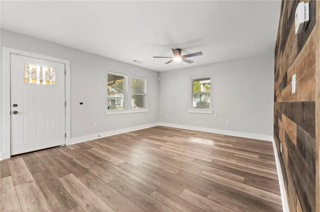 Foyer with wood finished floors and baseboards