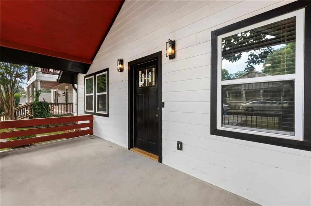 Property entrance with covered porch