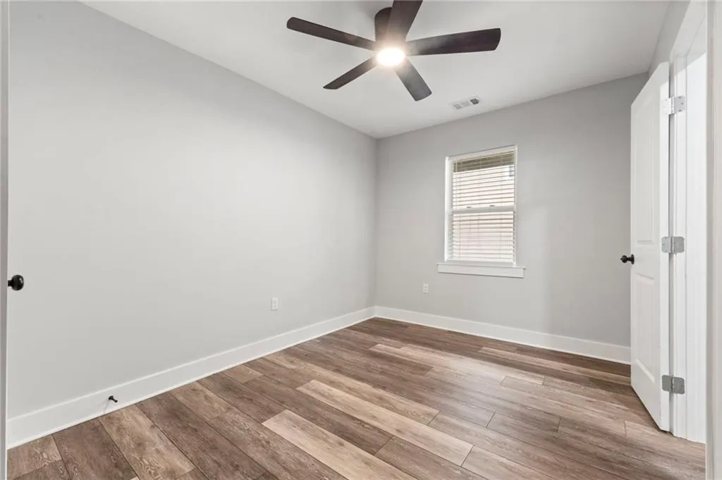Spare room with light wood-style flooring and ceiling fan