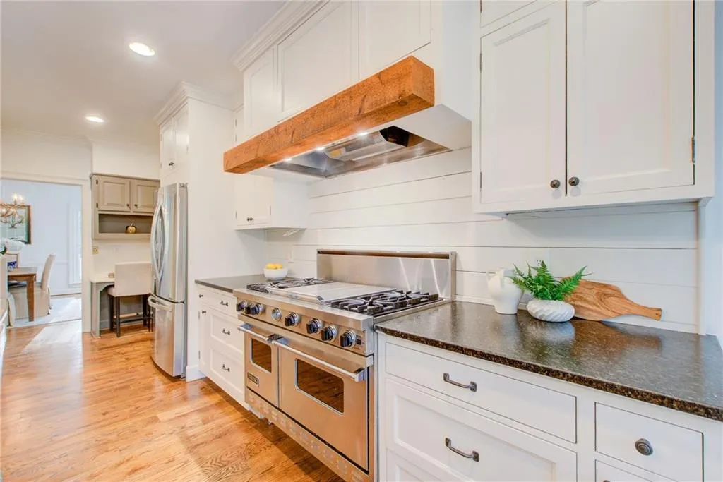 Take a look at this chef's kitchen with a Viking stove-oven and beautiful counter tops.