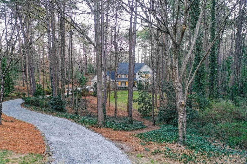 View of community featuring a view of trees