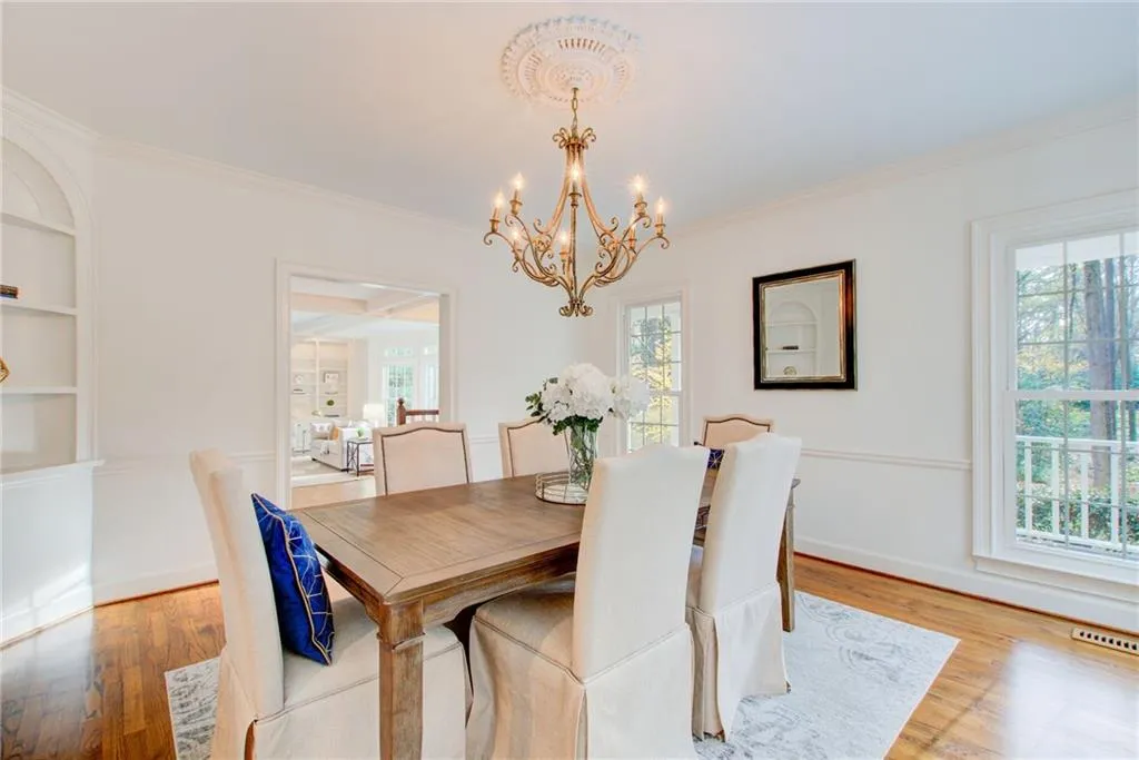 Beautiful banquet size dining room with beautiful build in's and floor to ceiling windows.
