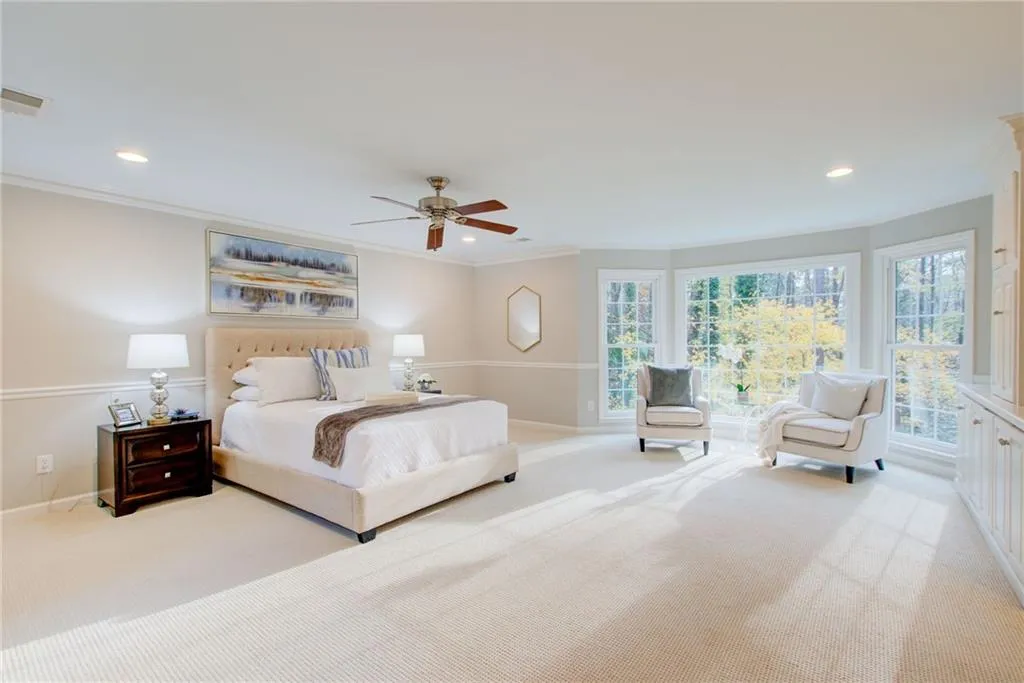 Primary suite is spacious, bright and room for a sitting area