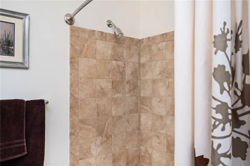Bathroom featuring a tile shower
