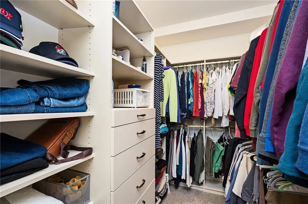 Walk in closet featuring carpet flooring