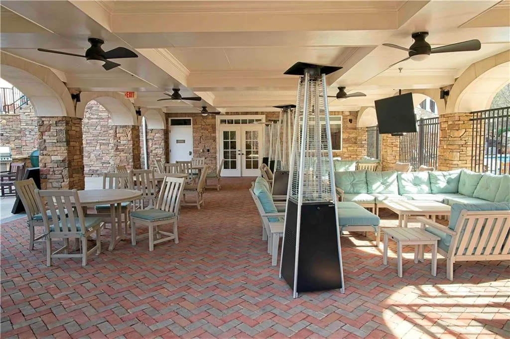 View of patio featuring an outdoor living space, french doors, outdoor dining area, and ceiling fan