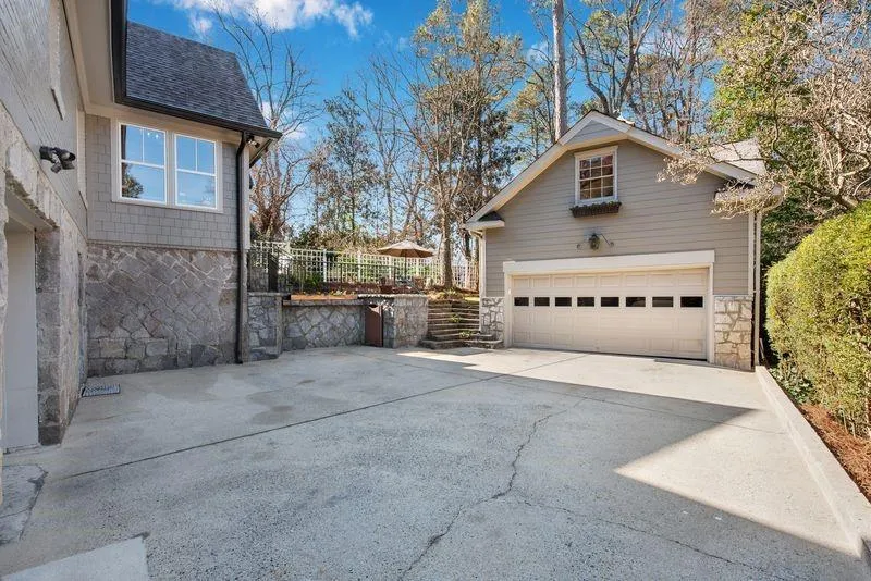Garage featuring concrete driveway