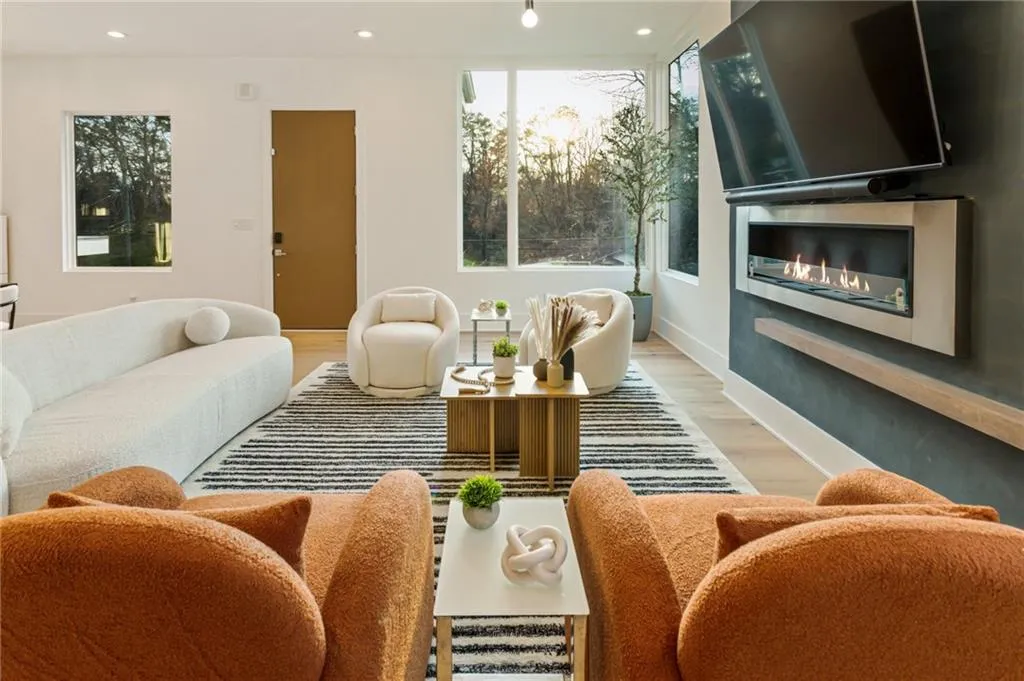 Living area featuring light wood-style flooring and recessed lighting