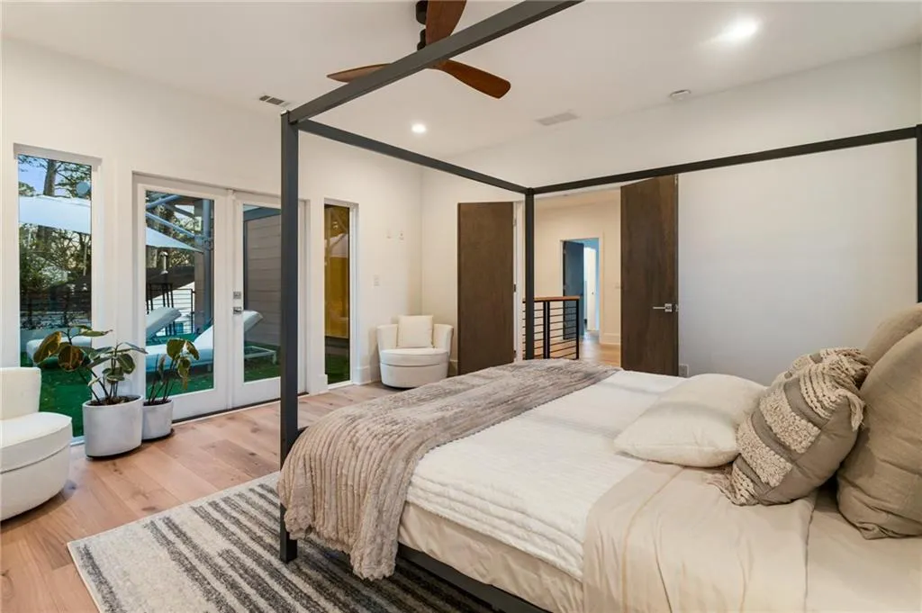 Bedroom featuring access to outside, wood finished floors, french doors, a ceiling fan, and recessed lighting