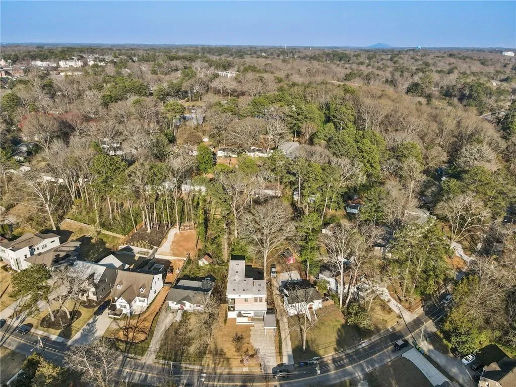 Aerial overview of property's location featuring nearby suburban area
