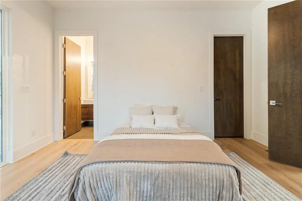 Bedroom featuring light wood-type flooring and baseboards