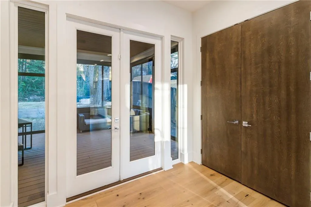 Doorway featuring light wood-style floors and french doors