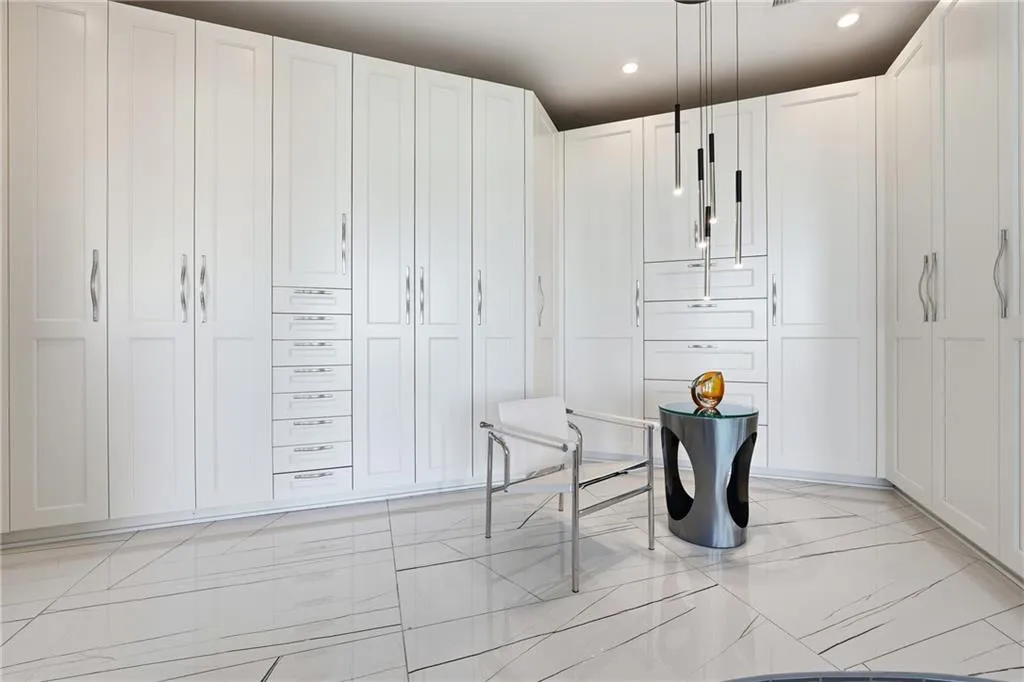 Beautifully designed closets offering. exceptional space and organization. Hers.