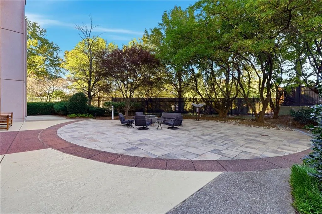 A serene patio behind the building provides a stylish outdoor retreat for residents Perfect for relaxing or entertaining.