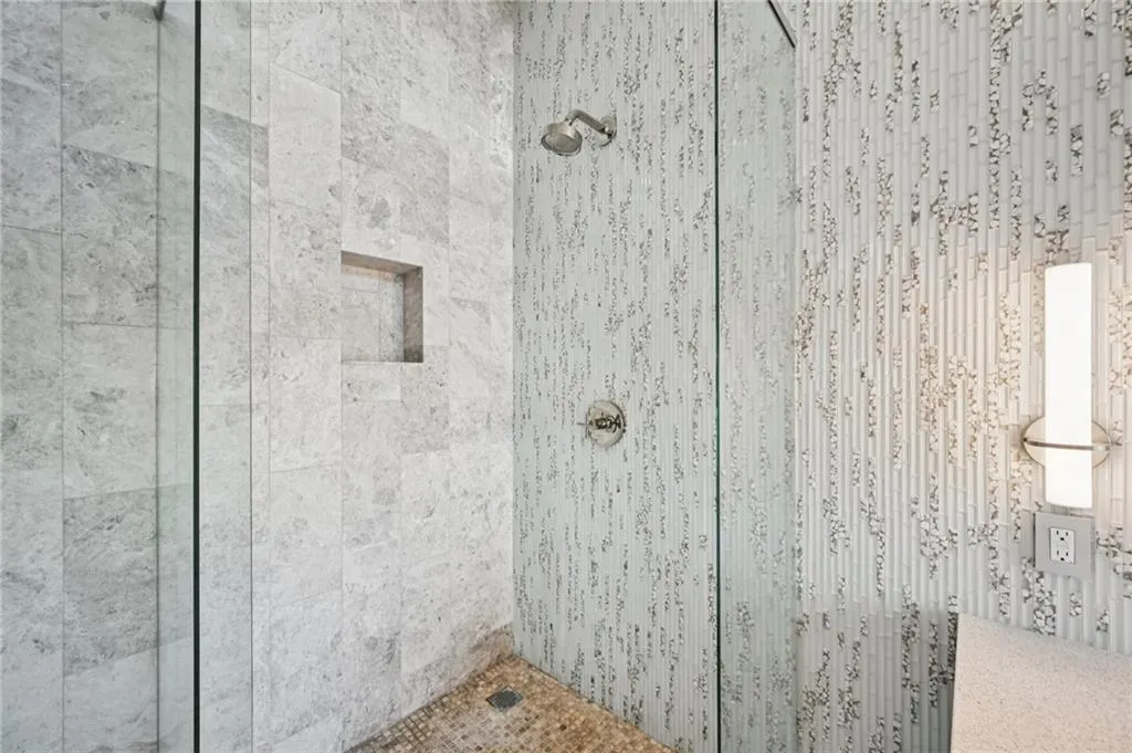Full bathroom with a tile shower