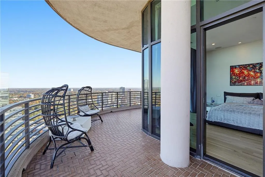 Wrap-around balcony featuring panoramic city views,  a perfect spot for morning coffee or evening entertaining.