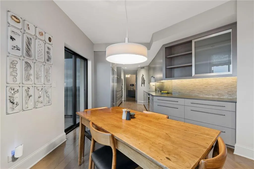 Dining space with baseboards and light wood-style floors