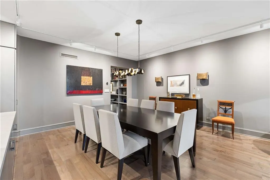 Dining room featuring light wood-style floors and suspended lighting