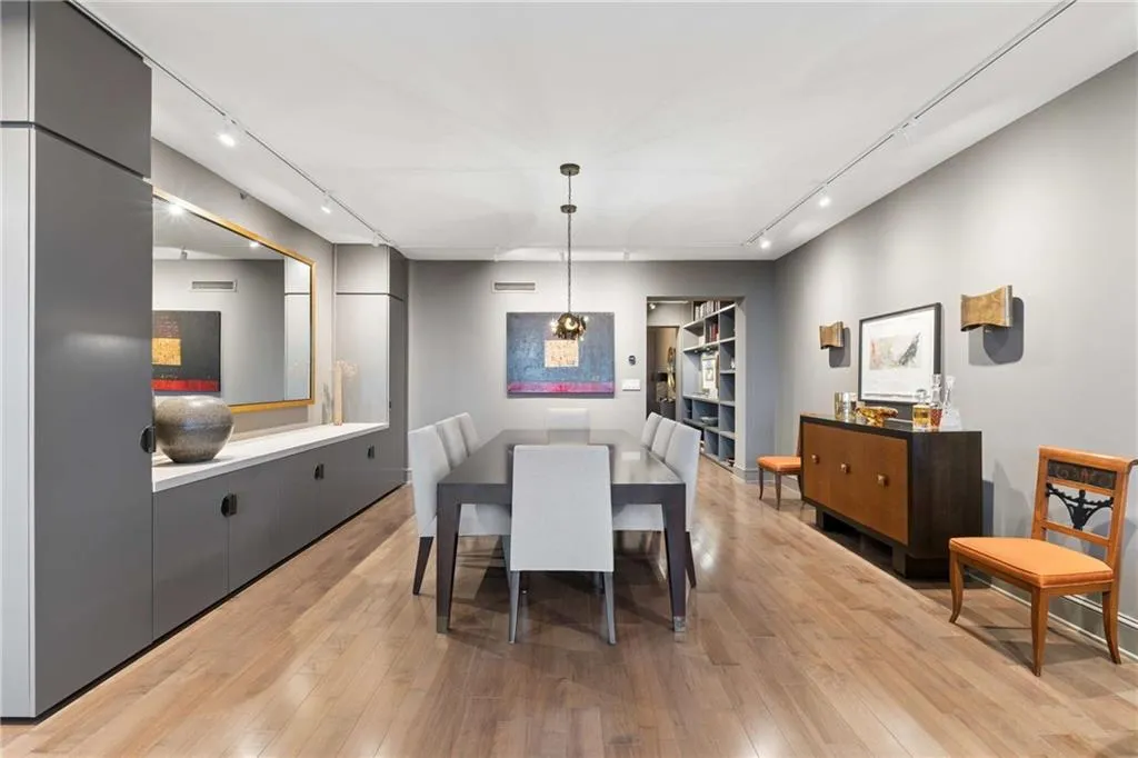 Dining room featuring track lighting and light wood-style floors