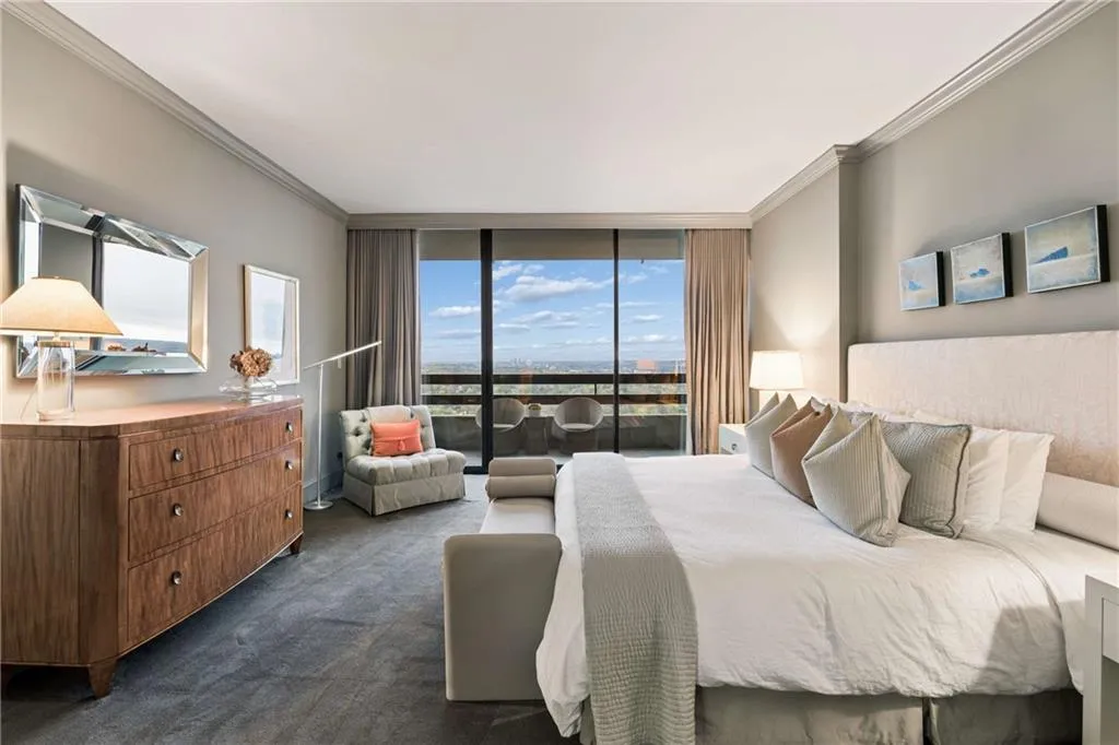 Bedroom featuring floor to ceiling windows, crown molding, access to outside, and dark carpet