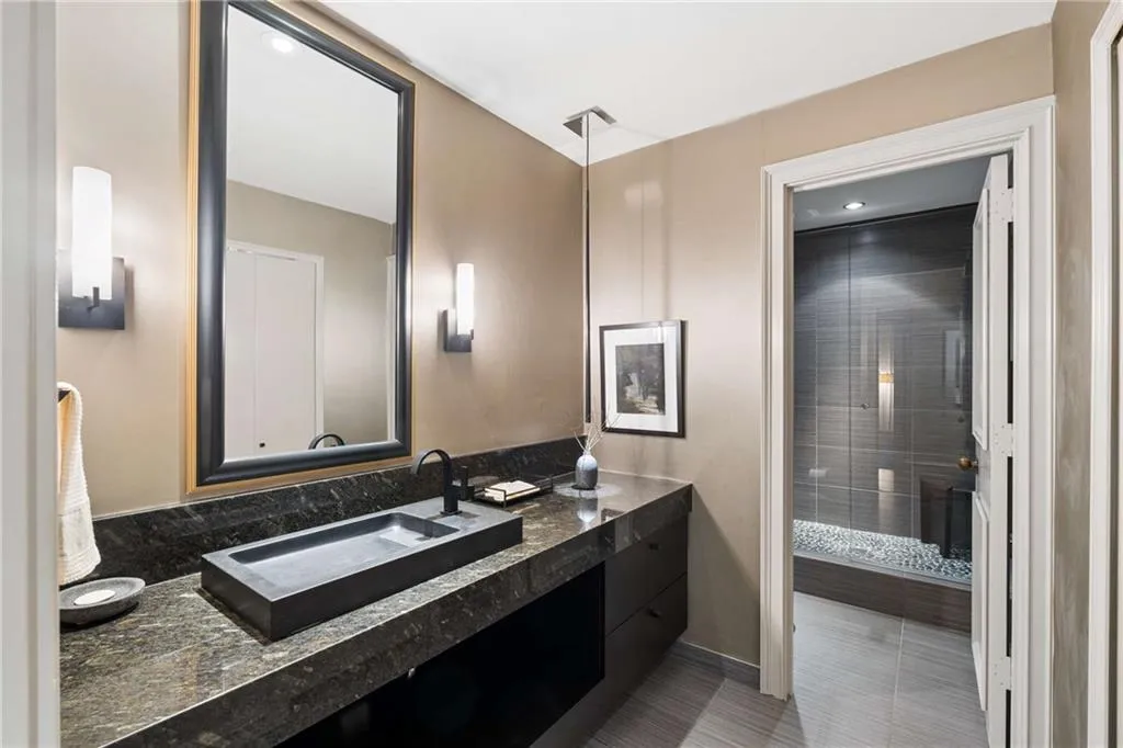 Bathroom with vanity, a stall shower, and recessed lighting
