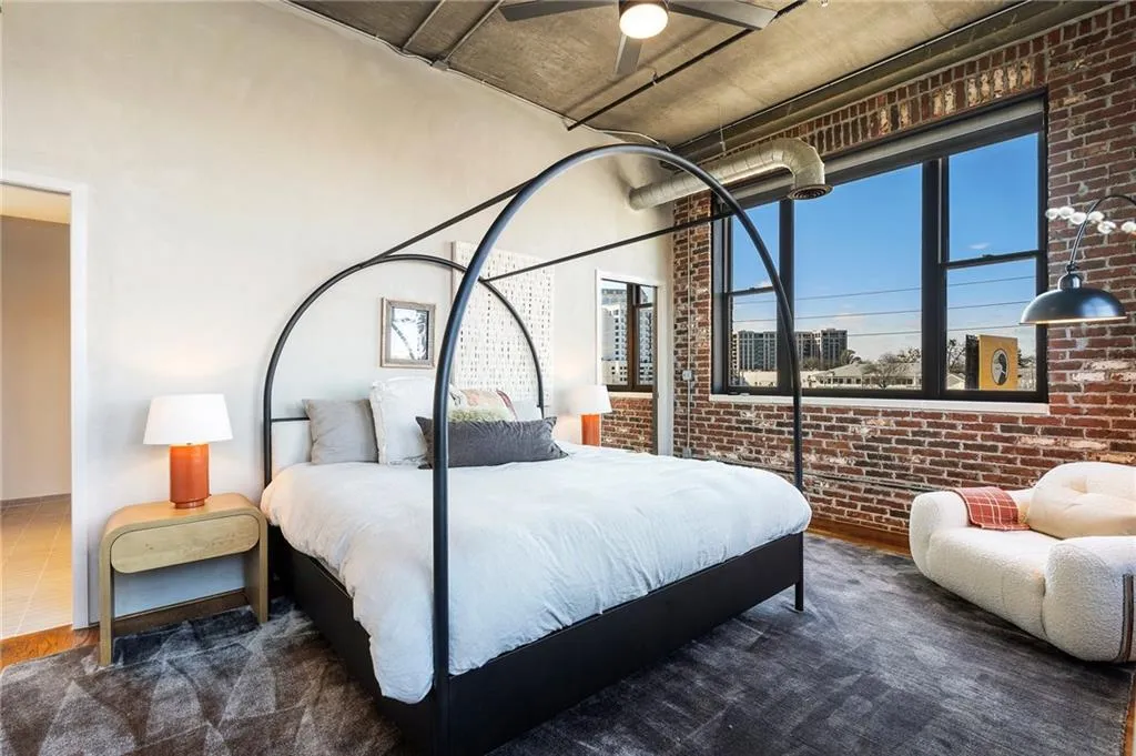 Bedroom with brick wall