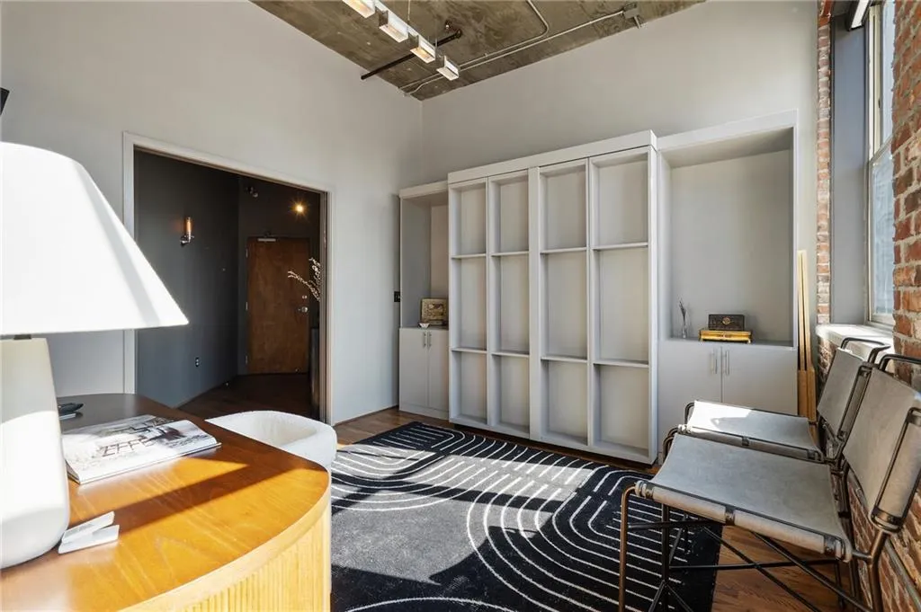 Home office with dark wood-type flooring