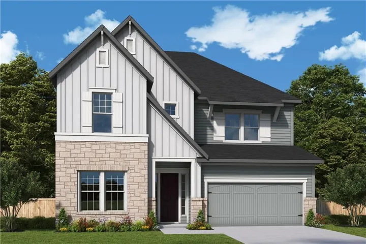 Two-story residence featuring a combination of stone veneer and board and batten siding